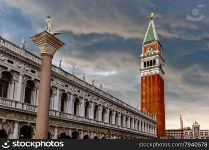 St. Marks Campanile on St. Marks Square and column with a statue of Saint Theodore after the storm, Venice, Italy