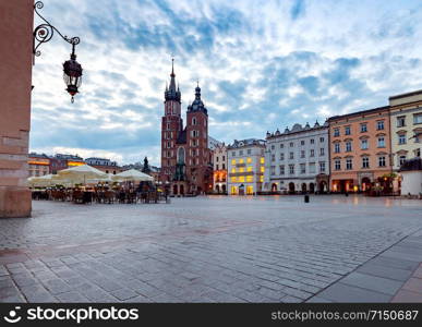 St. Mary&rsquo;s Church on the market square in night lighting. Krakow. Poland.. Krakow. St. Mary&rsquo;s Church and market square at dawn.