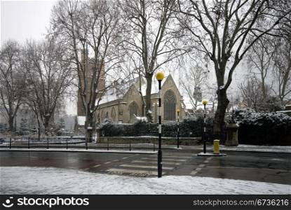St Marys church, and the adjacent Lambeth Palace Road, London, England, on a cold, snowy, Winter&rsquo;s day.