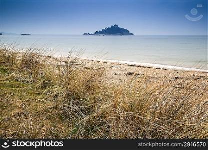 St Michael&acute;s Mount Bay Marazion landscape viewed through sand dunes Cornwall England