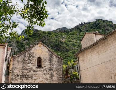 St Michael's Church on pedestrian streets of old town Kotor in Montenegro. Narrow streets in the Old Town of Kotor in Montenegro