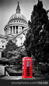 St Paul?s Cathedral dome and red telephone booth. Symbols of London, the UK. Black and white. St Paul?s Cathedral dome and red telephone booth. London, the UK.