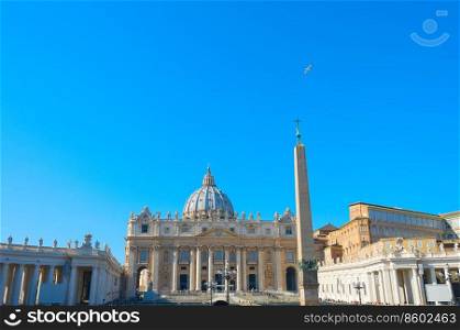 St. Peter basilica with clear sky and flying birds. Vatican, Roma, Italy