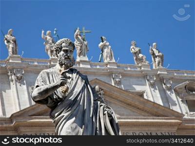 St Peter statue in St. Peter Square (Rome, Italy) with blue sky background