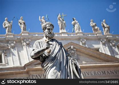 St Peter statue in St. Peter Square (Rome, Italy) with blue sky background