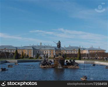 ST. PETERSBURG, RUSSIA, May 10, 2018: The Petergof or Peterhof, known as Petrodvorets from 1944 to 1997 and Neptune Fountain on May 10, 2018 in St. Petersburg, Russia. The Petergof or Peterhof, known as Petrodvorets from 1944 to 1997 and Neptune Fountain on May 12, 2018 in St. Petersburg, Russia