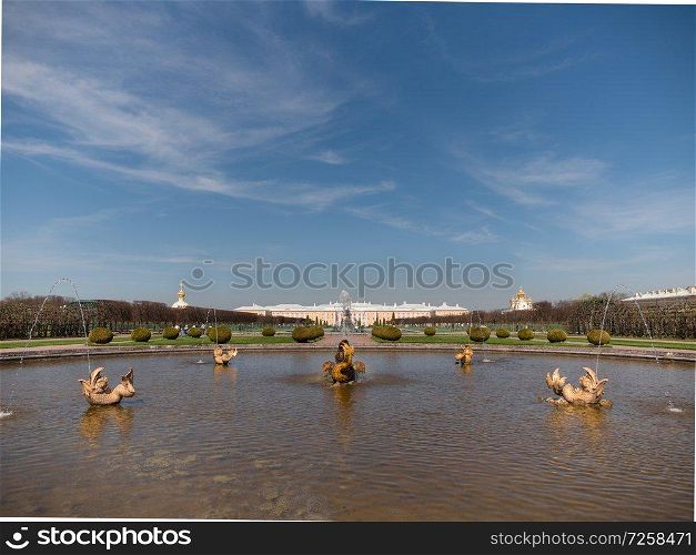 ST. PETERSBURG, RUSSIA, May 10, 2018: The Petergof or Peterhof, known as Petrodvorets from 1944 to 1997 and Neptune Fountain on May 10, 2018 in St. Petersburg, Russia. The Petergof or Peterhof, known as Petrodvorets from 1944 to 1997 and Neptune Fountain on May 12, 2018 in St. Petersburg, Russia