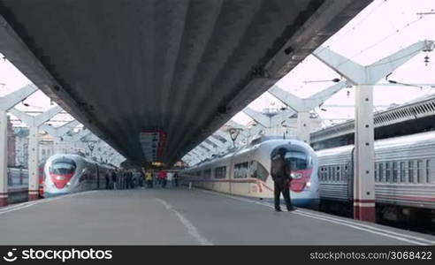 ST-PETERSBURG, RUSSIA - SEPTEMBER 9: High speed train Sapsan departs from the railway station. The trains started regular service on the Moscow&#1074;&#1026;&#8220;Petersburg Railway in December 2009 at a max speed of 250 kmh. Shot on September 9, 2013 in St-Petersburg, Russia