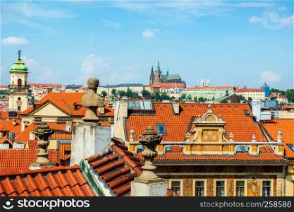 St Vitus cathedral and red roofs of Prague at summer day