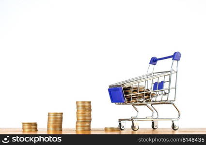 Stack coin with shopping cart or trolley, Excessive shopping causes financial problems, lavish spending. Online shopping and e-commerce concept.