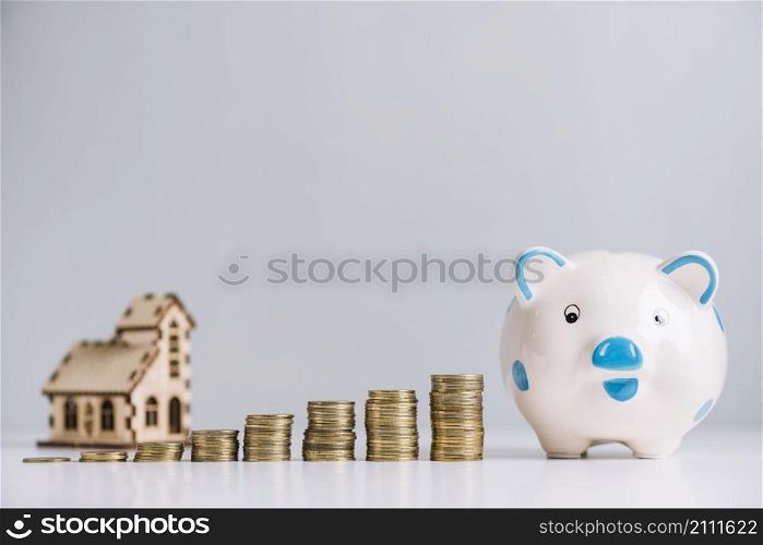 stack increasing coins piggybank front house model