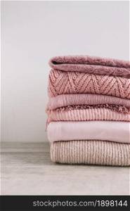 stack knitted sweaters floor2. Resolution and high quality beautiful photo. stack knitted sweaters floor2. High quality beautiful photo concept