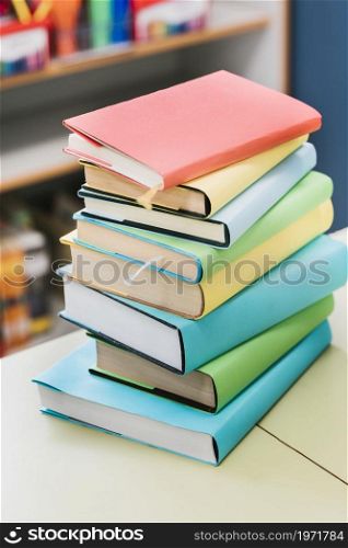 stack multicolored books table. High resolution photo. stack multicolored books table. High quality photo