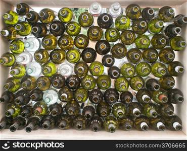 stack of assorted empty wine bottles