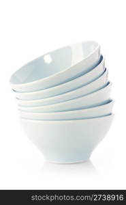 Stack of blue bowls over white