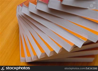 Stack of book in office desktop. Close up paper&rsquo;s pages.