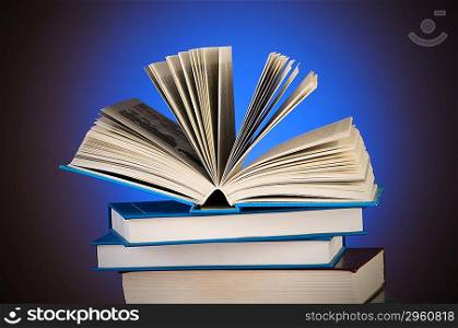 Stack of books against gradient background