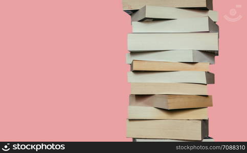 Stack of books before red background