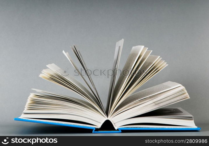 Stack of books on the color background