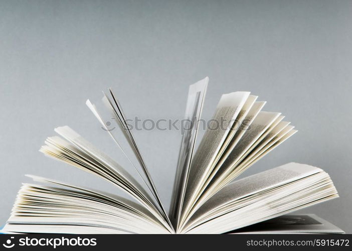 Stack of books on the color background