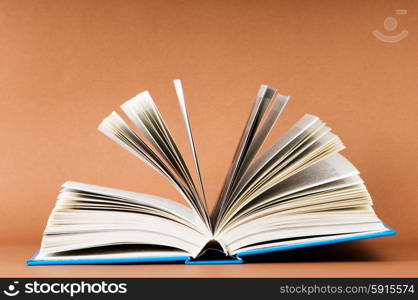 Stack of books on the color background