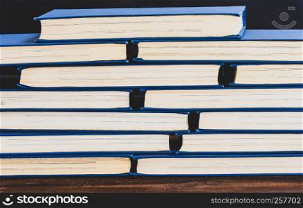 stack of books with yellow pages, close up