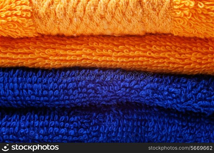 stack of bright colored cotton towels closeup