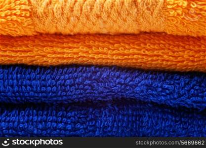 stack of bright colored cotton towels closeup