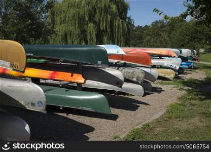 Stack of canoes in park, Minneapolis, Hennepin County, Minnesota, USA