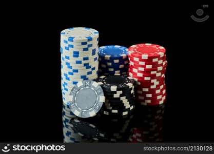 Stack of Casino gambling chips isolated on black.. Stack of Casino gambling chips isolated on black