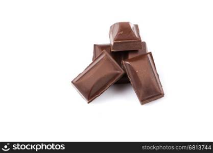Stack of chocolate pieces on a white backgroun and isolated