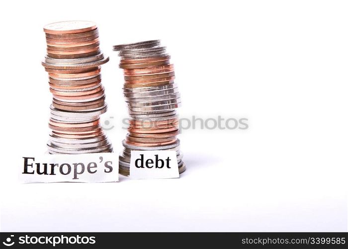stack of coins with Europe&rsquo;s debt in text