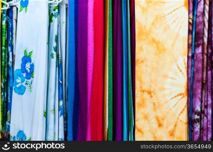 Stack of colorful fabric. Red, white, yellow, blue