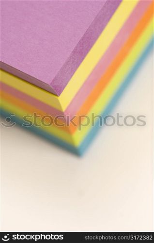Stack of colorful sticky notes.