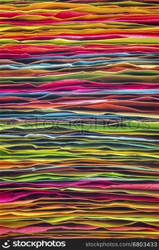 stack of colorful sticky notes - side view of rough paper edges