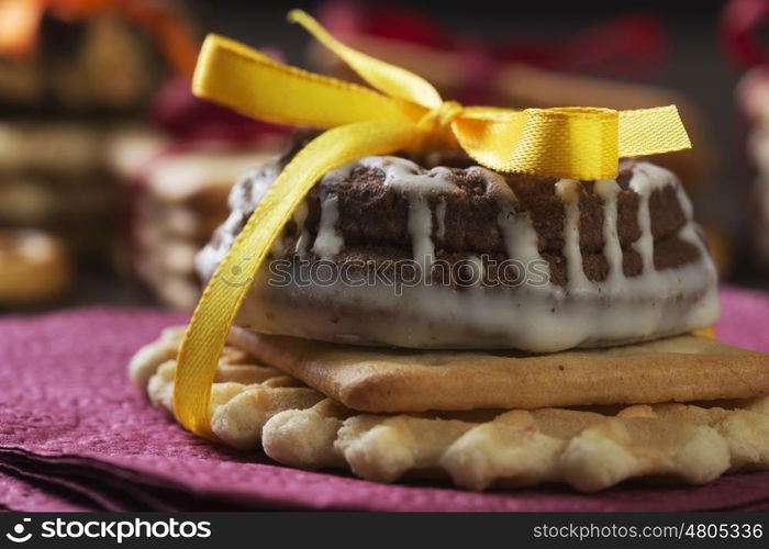 Stack of delicious cookies on table tied with ribbon. Sweet surprise