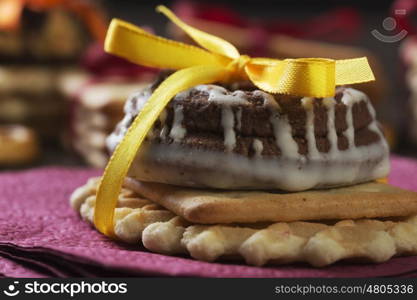 Stack of delicious cookies on table tied with ribbon. Sweet surprise