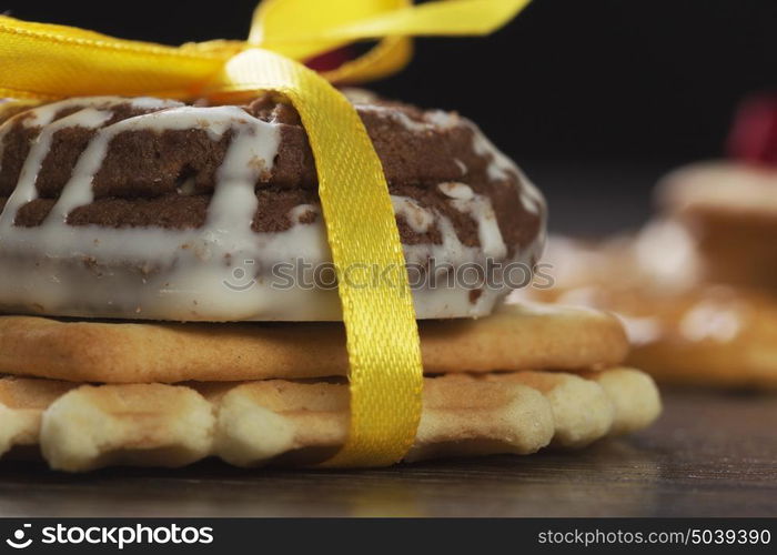 Stack of delicious cookies on table tied with ribbon. Sweet surprise