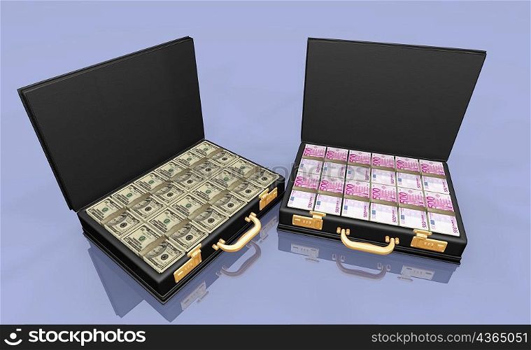 Stack of Euro bank notes and American dollar bills in briefcases