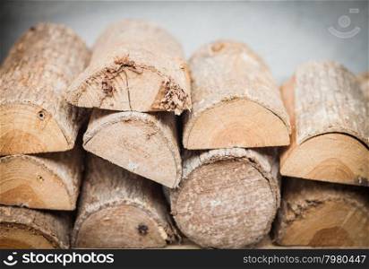 Stack of firewood decorated in garden, stock photo
