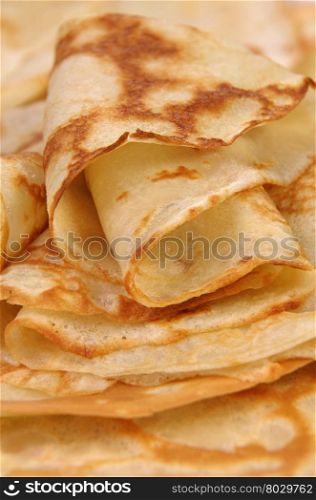 stack of folded crispy fried thin pancake closeup