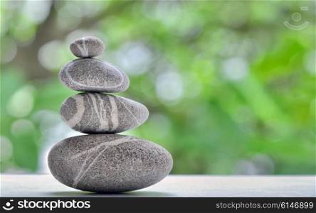 Stack of four stones isolated. stones in balanced pile