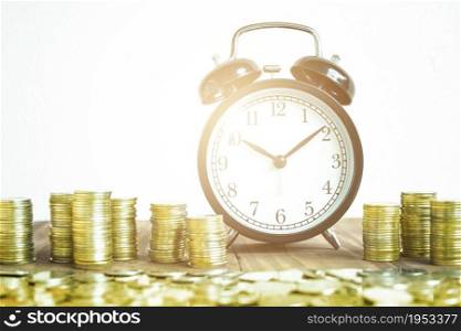 Stack Of Gold Coins With Black Fashioned Alarm Clock For Display Planning Money Financial And Business Accounting Concept, Time To Work At Make Money Concept, Vintage Color Tone