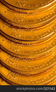 Stack of golden coins using US Treasury issue Gold Eagle one ounce pure gold coin. Stack of US Treasury Gold Eagle one ounce coins