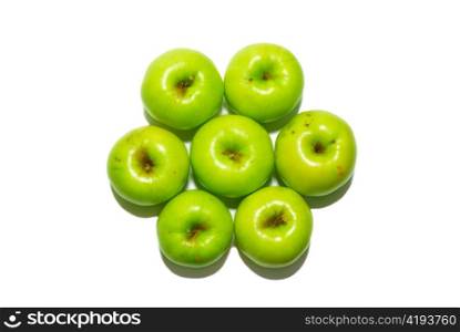 Stack of green apples isolated on white.