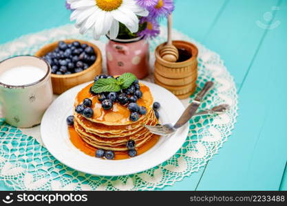 Stack of homemade pancakes on wooden background. Stack of pancakes on wooden background