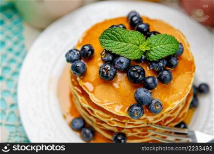 Stack of homemade pancakes on wooden background. Stack of pancakes on wooden background