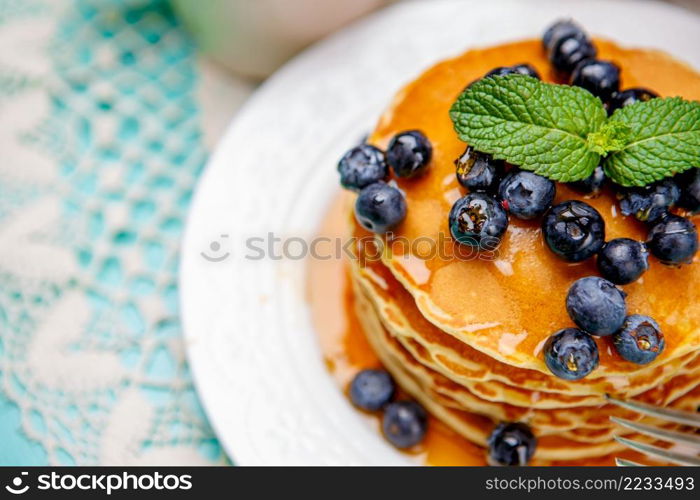 Stack of homemade pancakes on wooden background. Stack of pancakes on wooden background