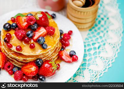 Stack of homemade pancakes on wooden background. Stack of pancakes on wooden background