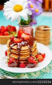 Stack of homemade pancakes on wooden background. Stack of pancakes on wooden background